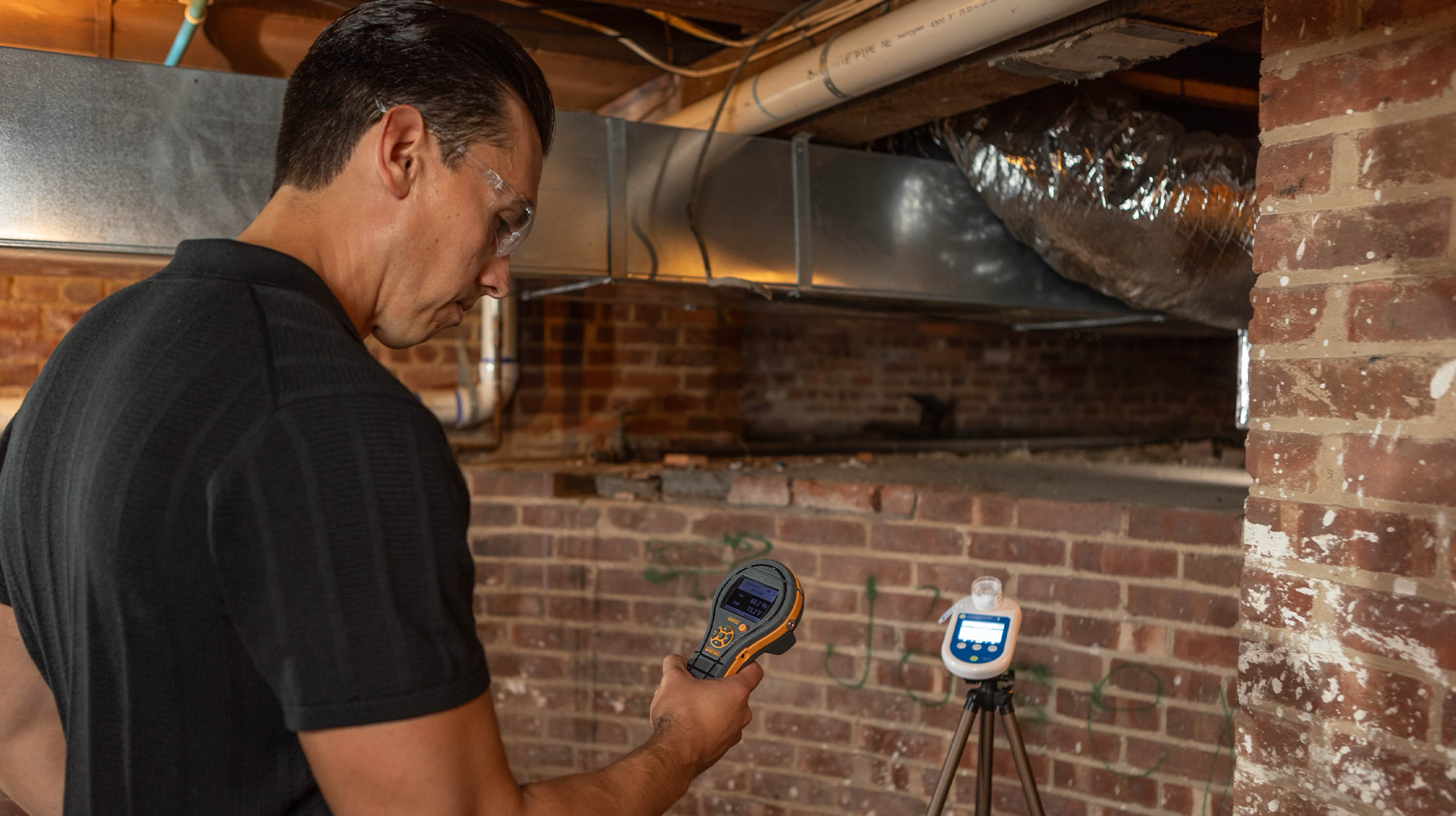 Mold inspector examining basement HVAC and ductwork